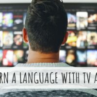 how to learn a language by watching tv and movies man watching tv