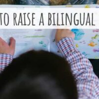 How to raise a bilingual child overhead view of child reading book