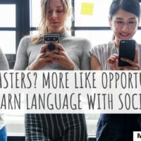 four people using their smartphones to learn a language with social media