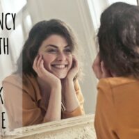 woman smiling at herself in the mirror text reads reach fluency faster with the self-talk technique mosalingua