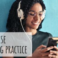 Woman listening to something on her phone with headphones and smiling. Text reads: Portuguese listening practice MosaLingua